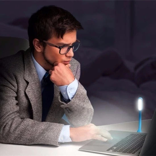 Eye care bendable USB LED reading light used on laptop keyboard for late night work in Sri Lanka